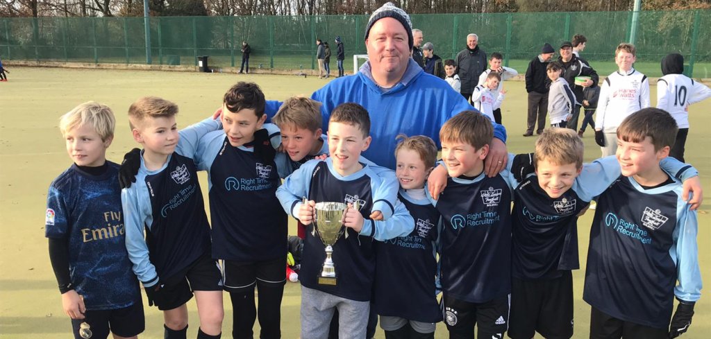 Dark Blues with winners Trophy